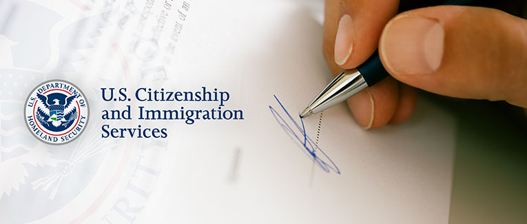 How do you sign USCIS forms?